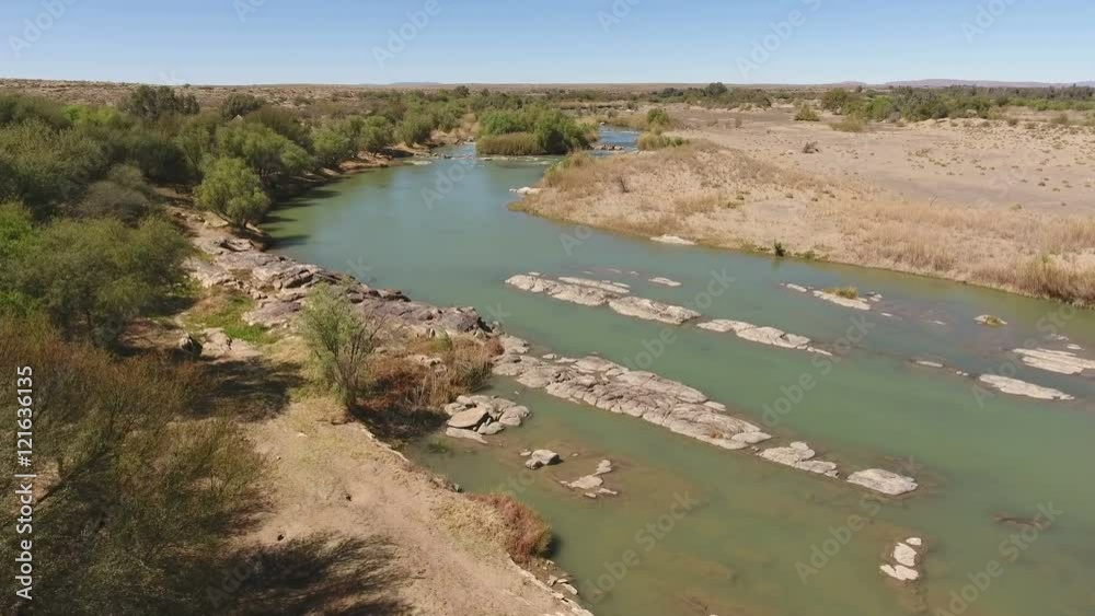 Wall mural Aerial view of the Orange river - longest river in South Africa - flowing through the arid region of the Northern Cape 