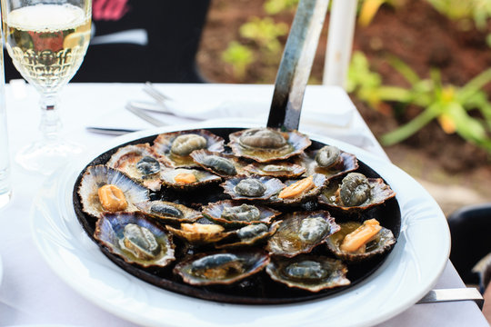 Traditional Madeira dishes-limpet (lapas), Madeira, Portugal  