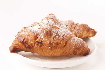 Fresh croissant on white background