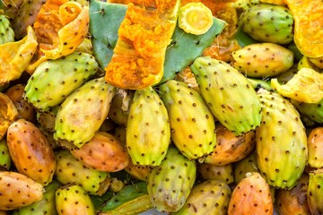 Prickly pear cactus closeup fruits in green,yellow and orange colours.