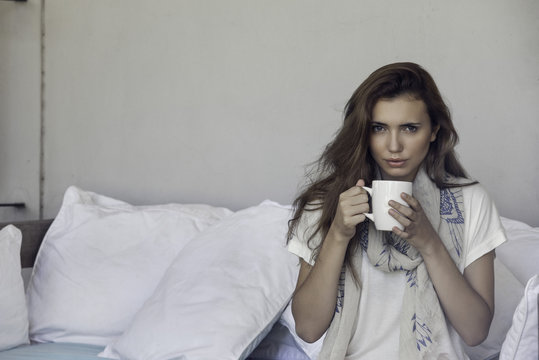 Woman enjoying cup of coffee