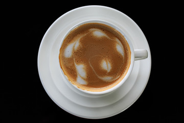coffee cup on black background with reflection