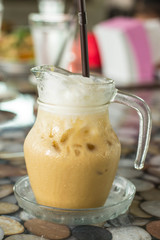 Coffee in a glass with ice in a restaurant