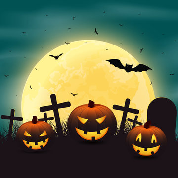 Halloween background with pumpkins in the graveyard, and a bright yellow moon night.
