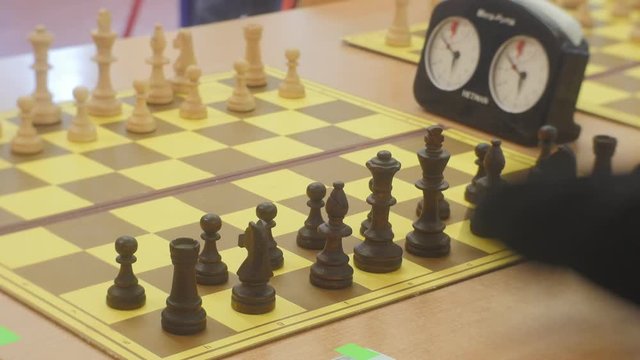 Chess Pieces Set up in the Initial Position Timers on the Table at the Chess Grids Chess Club "black Knight" Strategy Board Game Opole Poland Daytime