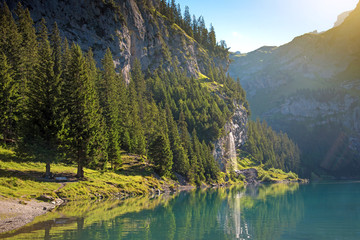 Fototapeta na wymiar Incredible landscape with a waterfall near Oeschinensee in Swiss
