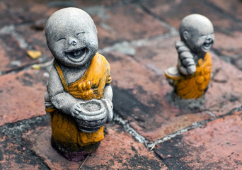 Ancient statuette at the buddhists temple in Ayuttaya, Thailand