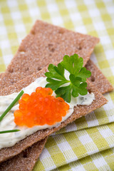 Crispbread with soft cheese with herbs and bacon.