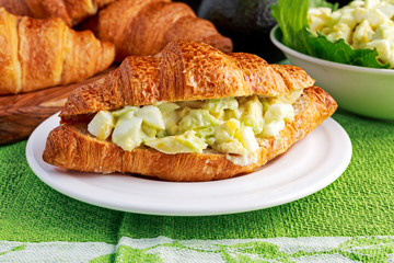 Morning Breakfast Croissant with avocado, egg salad