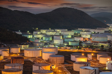 Big Industrial oil tanks in a refinery with treatment pond at industrial plants