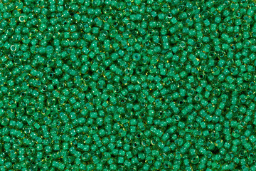 Clear light green glass beads. Close-up shot.