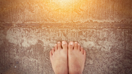 bare feet road background with sun ray effect