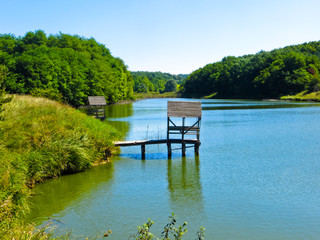 Fototapeta premium Wooden place for fishing on a lake