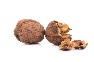 walnut and a cracked walnut isolated on the white background