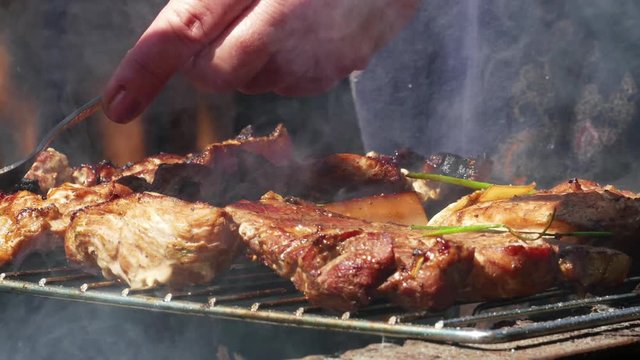 Close up of Pork Meat Steak on Barbecue Grill