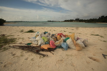 trash bags collected on maldivian beach