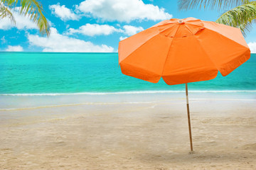 
Chaise lounge and umbrella on beach - obrazy, fototapety, plakaty