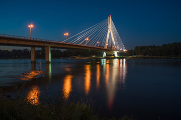 Night view of Swietokrzyski cable-stayed bridge in Warsaw, Poland