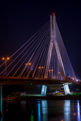 Fototapeta na wymiar Night view of Swietokrzyski cable-stayed bridge in Warsaw, Poland
