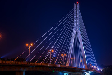 Night view of Swietokrzyski cable-stayed bridge in Warsaw, Poland