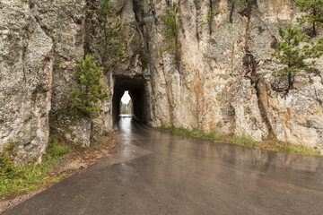 Needles Tunnel / A narrow tunnel on a road.