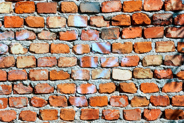 Old, rough red brick wall