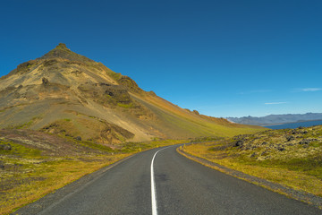 Isolated road and Icelandic colorful landscape at Iceland, summe
