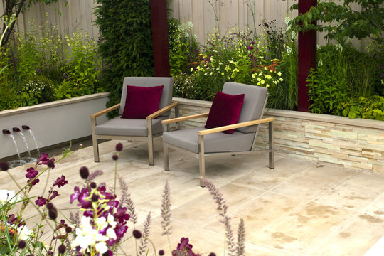 Tranquil garden with a patio and two seats
