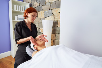 Head massage woman with physiotherapist