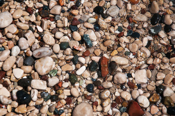 stones on beach and sea water