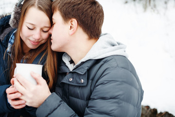 Young couple having fun outdoors in winter