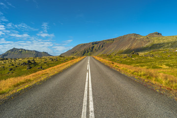 Isolated road and Icelandic colorful landscape at Iceland, summe