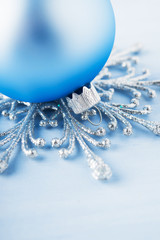 Silver and light blue christmas decoration on wooden background. Winter holidays. Xmas theme.