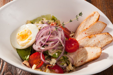 chicken breast salad with cherry tomatoes and egg