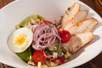 chicken breast salad with cherry tomatoes and egg