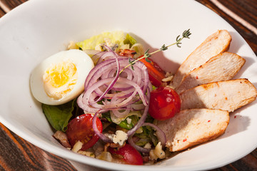 chicken breast salad with cherry tomatoes and egg
