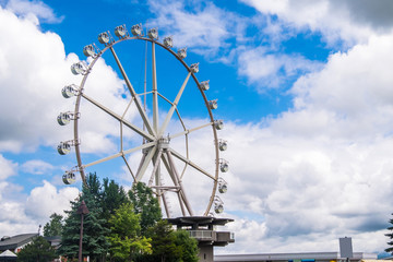 Ferris wheel with the blue sky