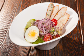 chicken breast salad with cherry tomatoes and egg