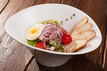 chicken breast salad with cherry tomatoes and egg
