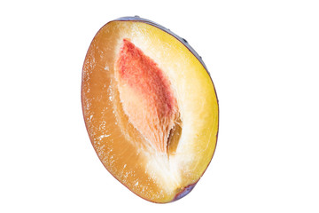 Half ripe plum on white background