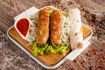 lula kebab on a wooden board 2