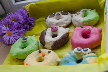 donuts in the form of animals. Multi-colored donuts. Sweets. Box of donuts