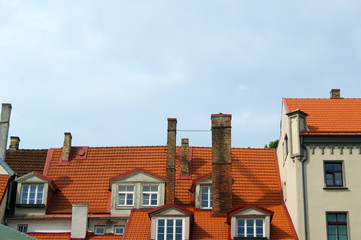The red garret roof with window and chimney, Riga, Latvia
