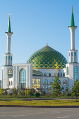 white mosque with green dome