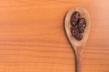 Dried Dates into a spoon. Tamara