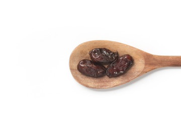 Dried Dates into a spoon. Tamara