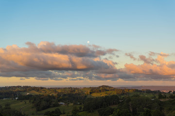 Obraz premium Golden sunset with the litte moon