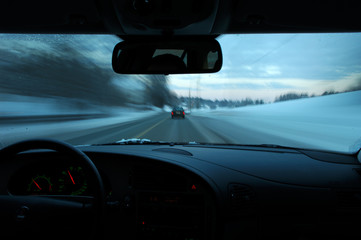 Obraz na płótnie Canvas Driving car at winter