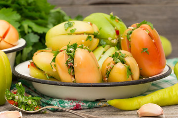 Green tomatoes stuffed with pepper and herbs.