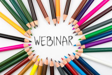 Colouring pencils in circle arrangement with message WEBINAR